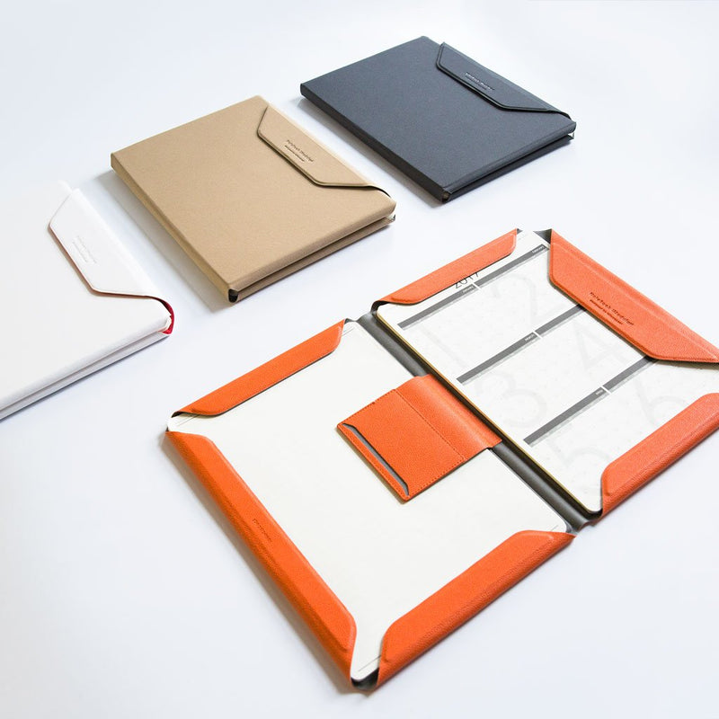 The square notebook that inspired this work. This fold here is